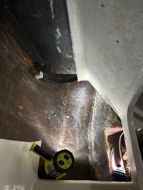 Floor just in front of toilet removed