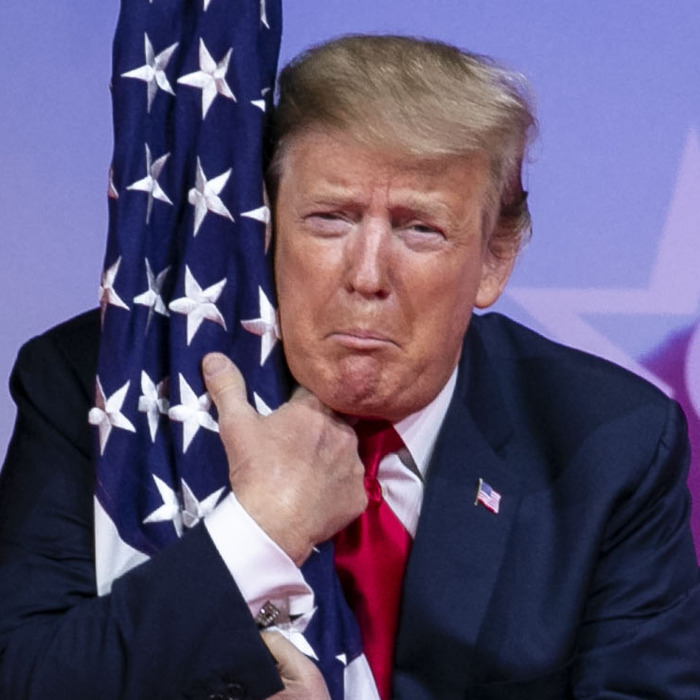02-CPAC-Trump-Hugs-Flag-w700-h700