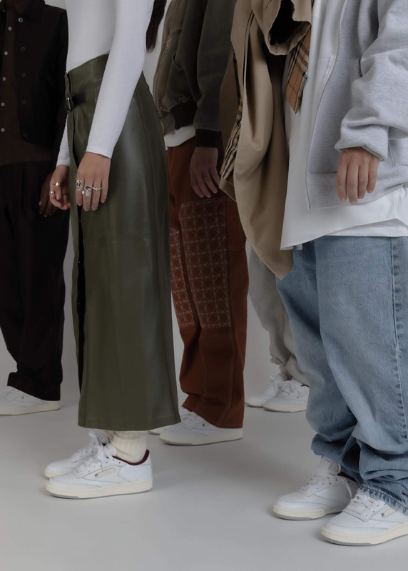 A group of people wearing Reebok's