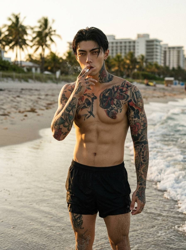 Man on beach smoking 202605131518