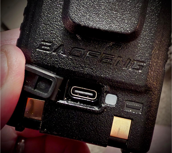 BTech BF-F8HP PRO handheld transceiver on a ham radio desk