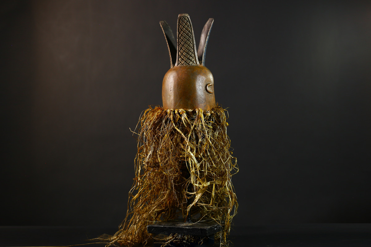 Back view of carved helmet form