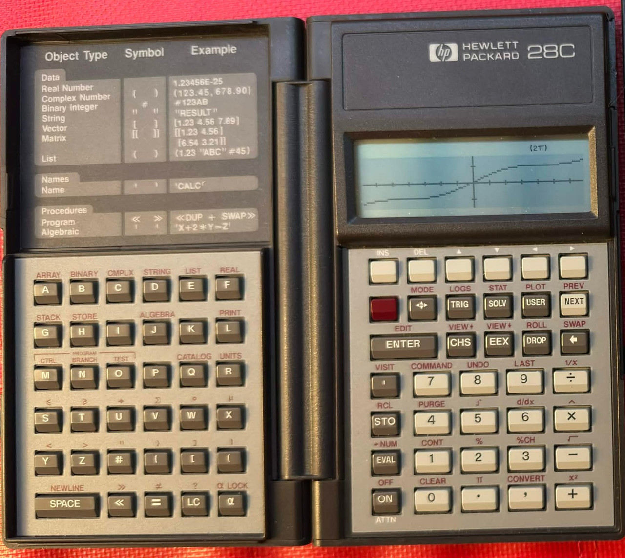 Hewlett-Packard HP 28C Graphing Calculator displaying the function f(x)=0.5(x+sinx)
