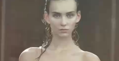 Rachel Cook A Sexy, Classy Naked Girl Sitting With Her Tits Out And Something Coming Out Of Her Mouth.