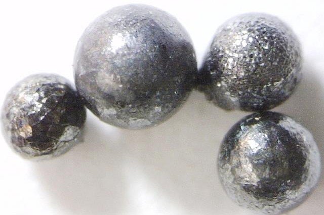 Micrometeoritos met�licos fotografiados al microscopio