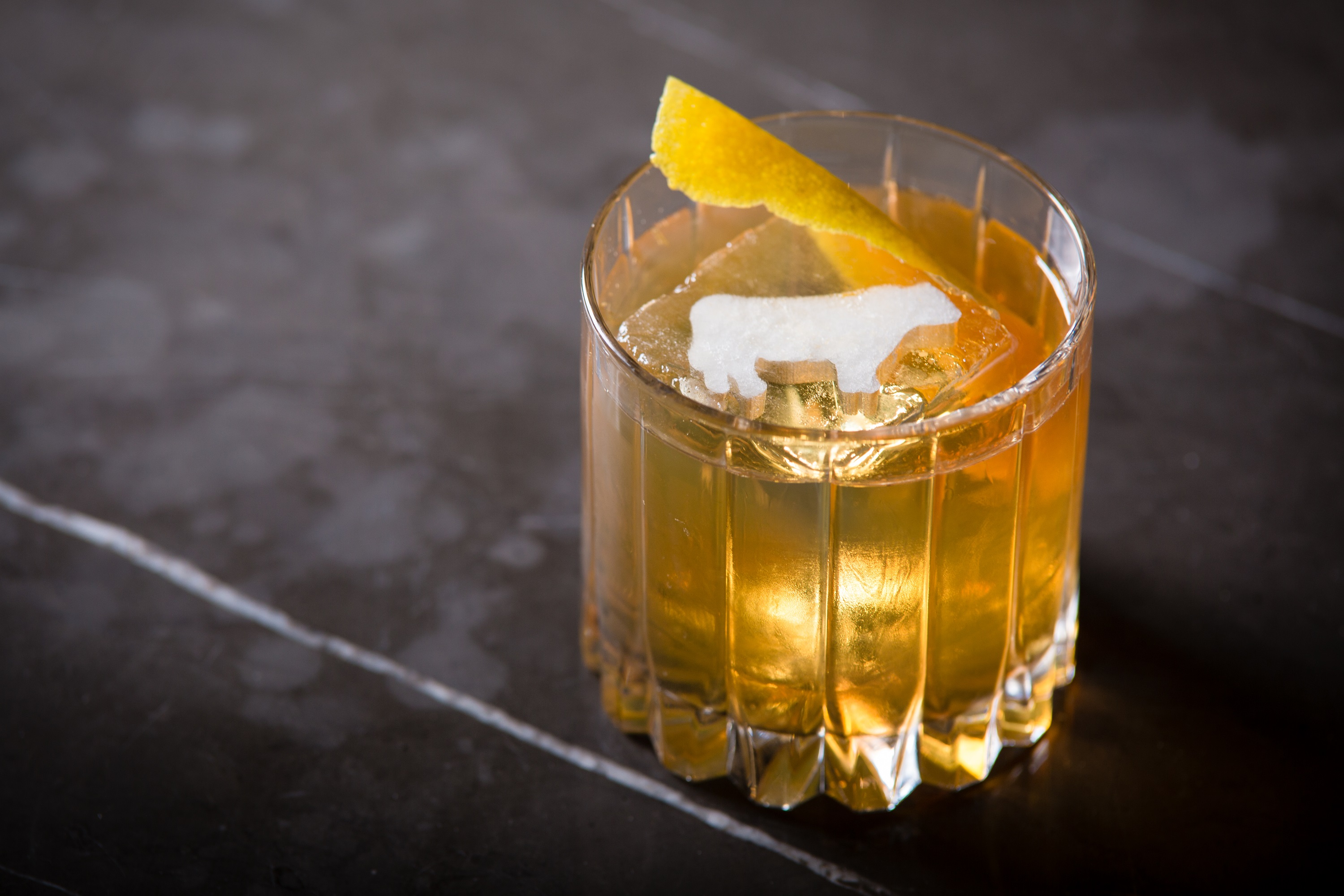 Tableside gin cocktail preparation with botanical selection