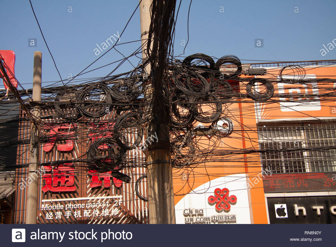 messy-tangle-of-electric-and-telephone-wires-on-street-pole-shanghai-china-december-29-2014-RN6N0Y
