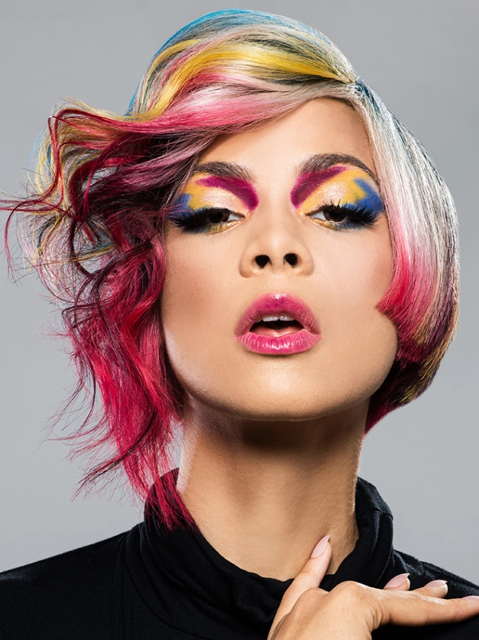 Pink and yellow color on blonde wavy and curly medium Jellyfish haircut