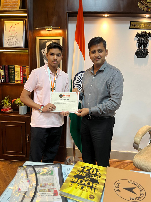 Raj receiving medal 2