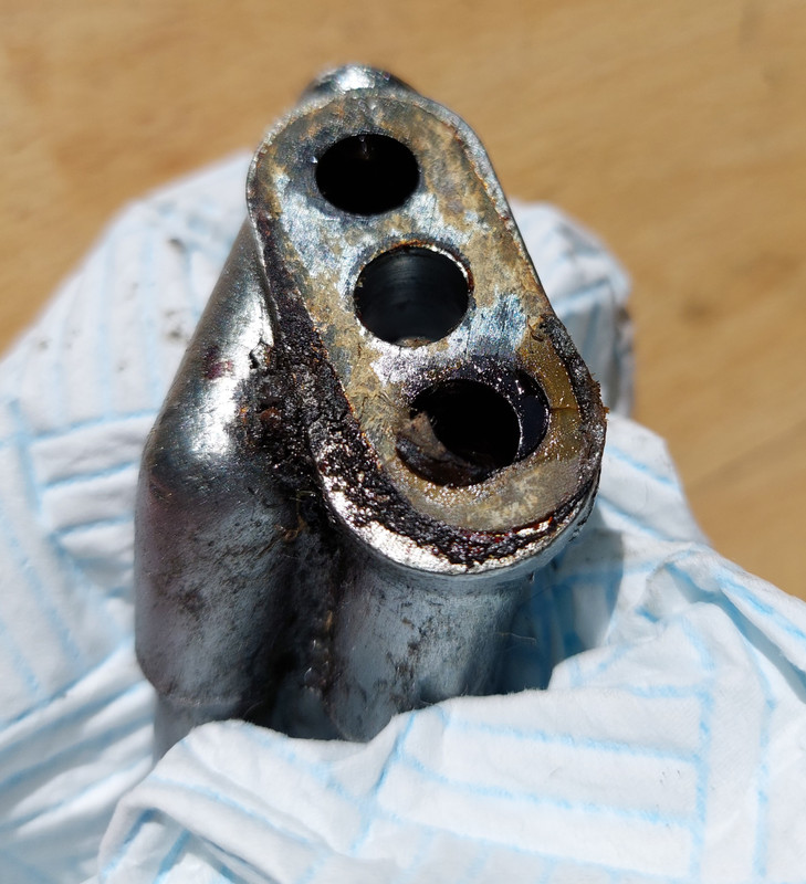 Original and new oil junction block.