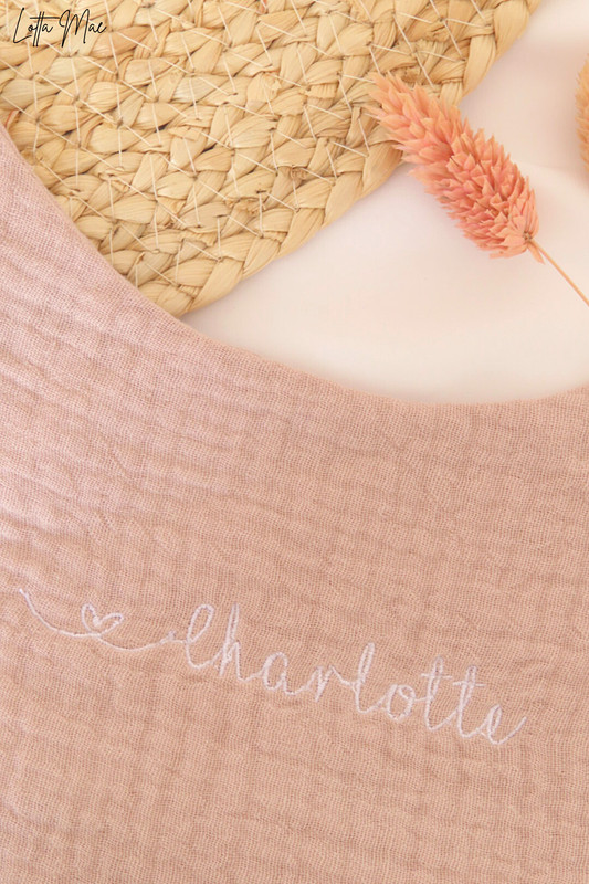 This baby bib is perfect for your little one! Made from 100% cotton, it’s soft and comfortable against delicate skin. It can be embroidered with a name or word of your choice in a variety of fonts and colors to create a personalized look. Plus, the snap buttons make it easy to put on and take off - no more struggling with ties! It’s perfect for everyday use, or an extra special occasion. 
Keep your baby clean and looking great in this stylish bib. Get yours today!