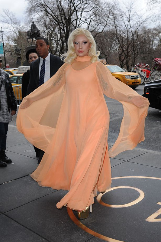 Lady-Gaga-wears-an-ethereal-orange-dress