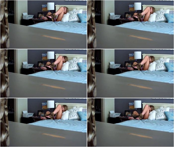 Sister-masturbates-with-a-toy-lying-on-the-bed-3.jpg