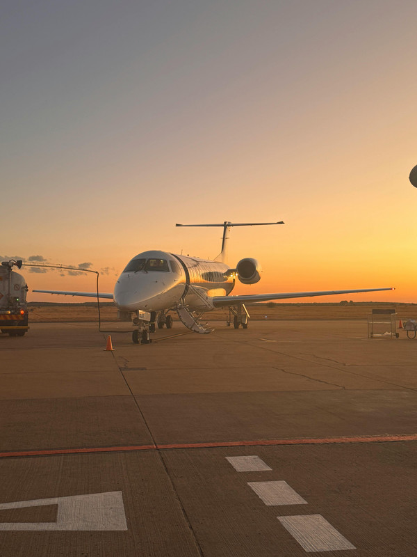Private aircraft at Palm Beach International Airport at sunset