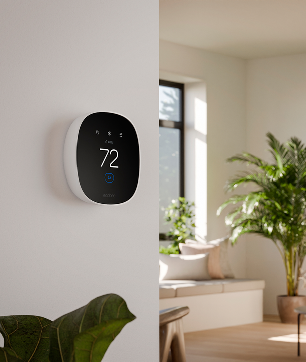 ecobee smart thermostat mounted on a wall