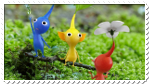 Red, yellow, and blue Pikmin standing in grass