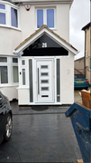 Extension project after - completed rendered porch extension with modern composite door number 26
