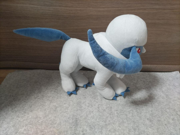 The Absol plush facing to the right