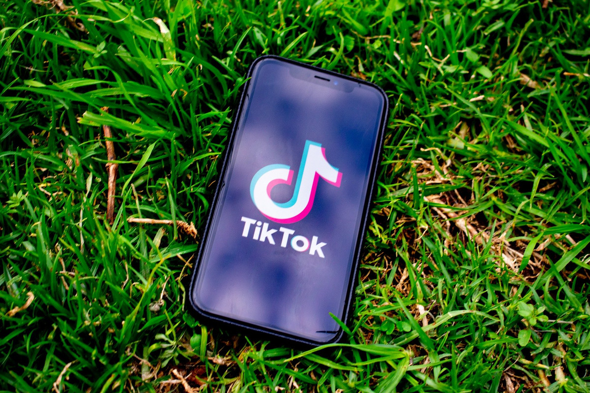 A smart phone with an image of the app TikTok on the screen.