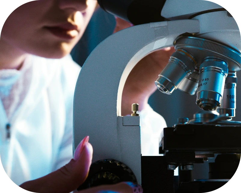 Scientist using a microscope