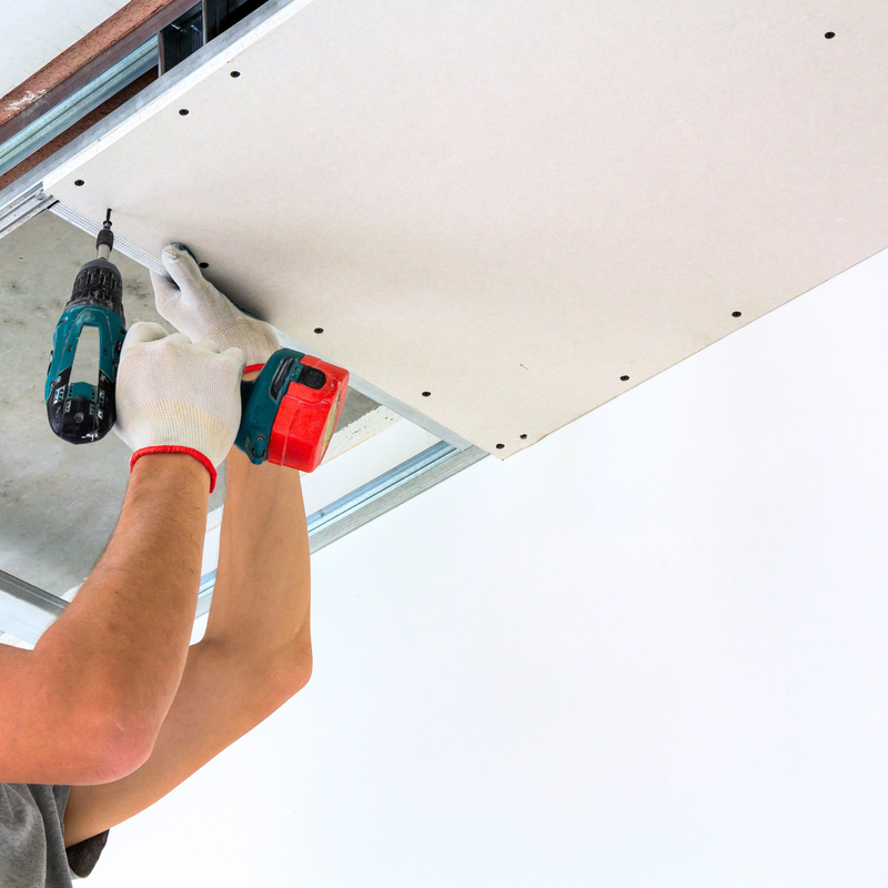 man working on drywall