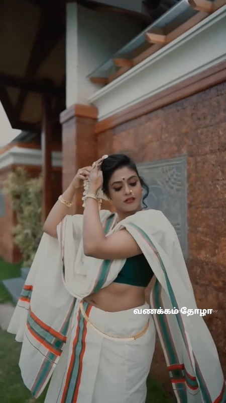 Iniya Sexy navel in Onam Photoshoot.webm_snapshot_00.18.359