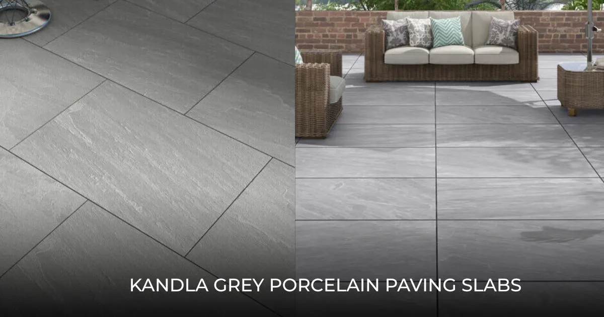 Kandla grey porcelain paving slabs installed in a garden patio sitting area featuring wicker sofas and a low brick wall. The textured grey stone-effect surface provides a modern, durable finish for outdoor terraces and courtyards.