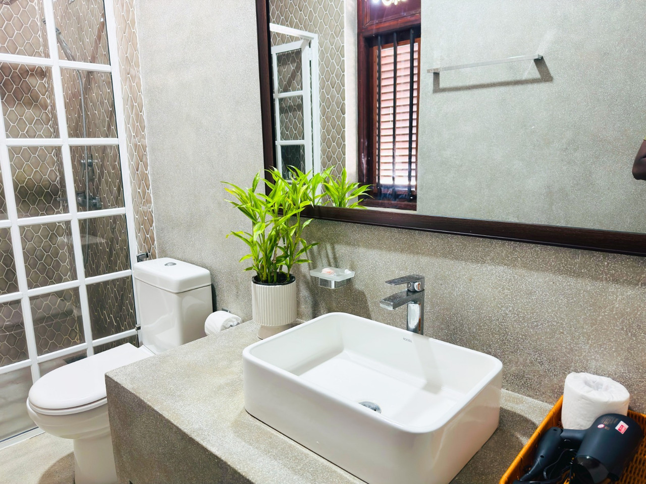 Modern bathroom with basin and greenery