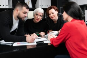 smiling-employees-talking-in-workplace-300×200.jpg