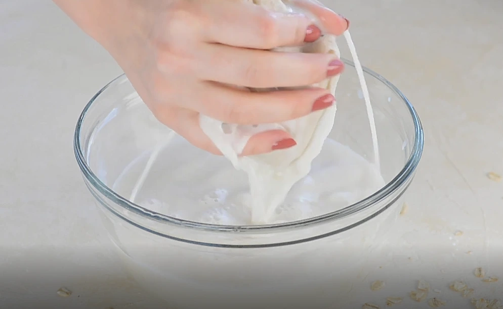 strain the oat milk in bowl