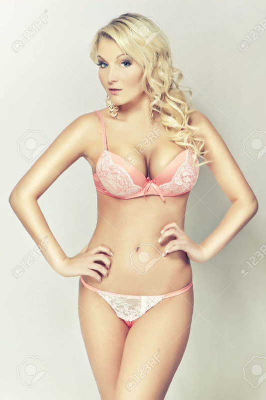 15299849 attractive blond girl in pink lingerie big breasts