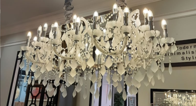 crystal squares held in place by chrome finish metal frames make up the sides and bottom of this gleaming rectangular island pendant. From the center, strands of unframed crystal disks and beads hang down at various lengths, creating a ravishing sense of elegant depth. 