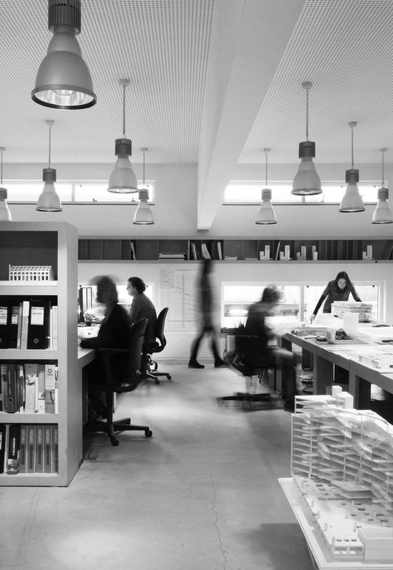 People working in a bright open office
