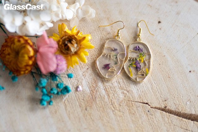 [Image: floral-face-resin-earrings-by-paige-alexander.jpg]