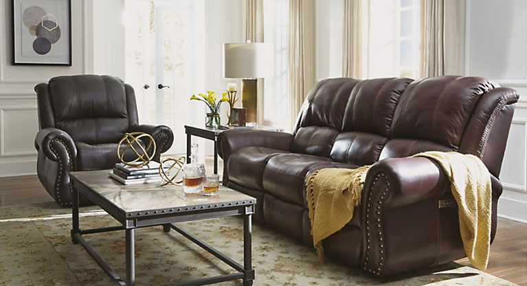 This Patton power recliner from Flexsteel is where versatility meets comfort and longevity. It features rolled arms, padded back cushion, and nailhead trim. Power mechanism allows you to smoothly recline to any position, adjust the headrests, and adjust the lumbar support.