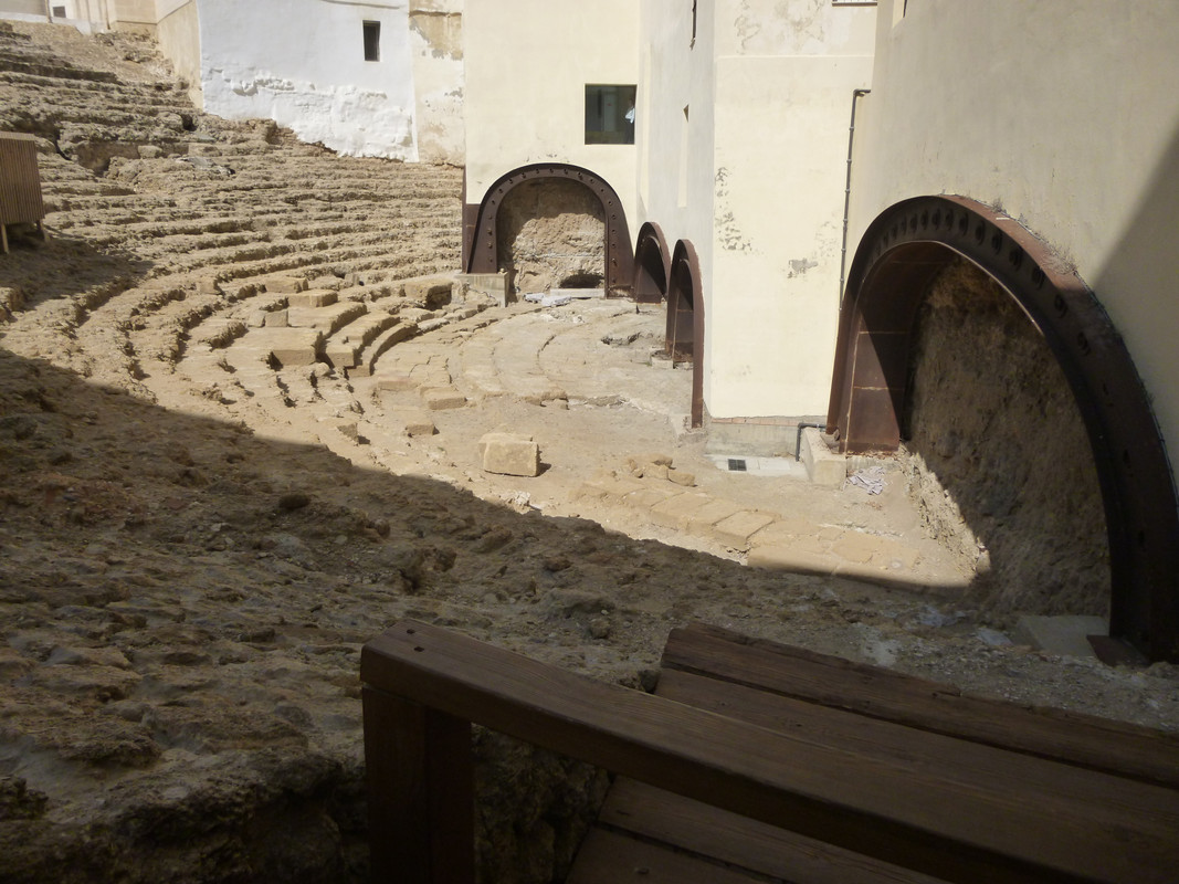 View down into the centre of the amphitheatre. The arches at the back have been reinforced with reddish metal.