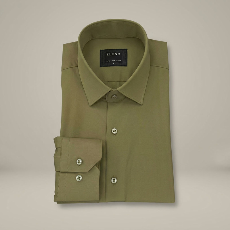 Ivory white dress shirt with subtle texture and spread collar on wooden surface