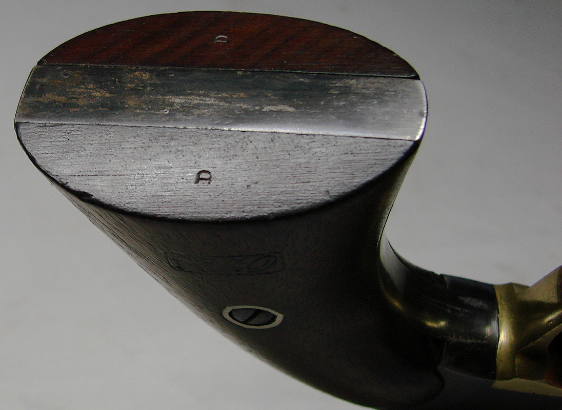 Inspector's initial  on the bottom of the grips