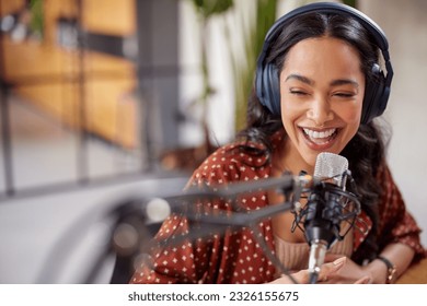 cheerful-young-woman-recording-podcast-260nw-2326155675.jpg
