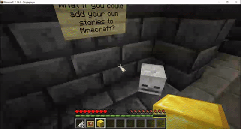 A player investigating a spooky dungeon uses a feather to uncover a cache containing a mysterious book!
