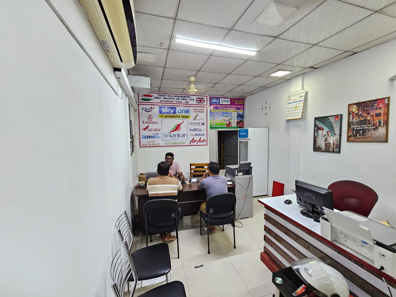 Inside the Sky One Travels office in Kattankudy — our team assisting customers