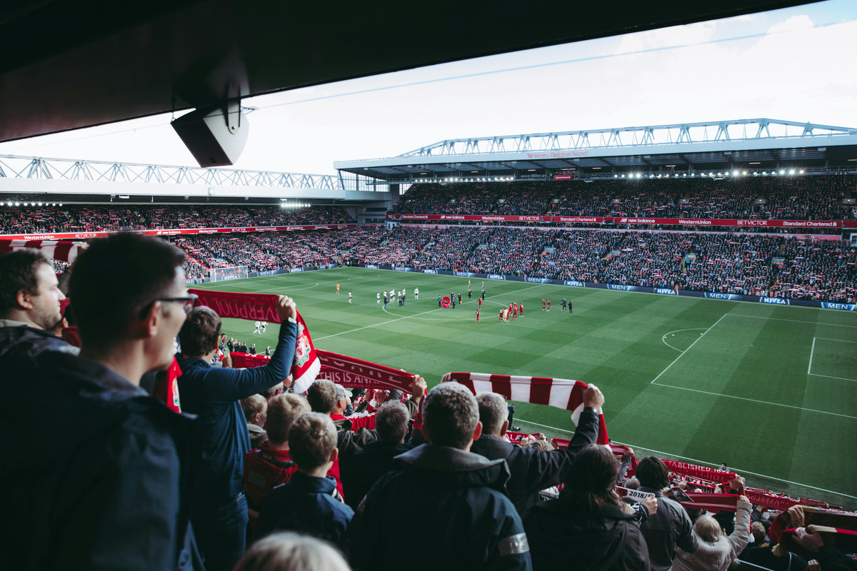fans watch football at stadium