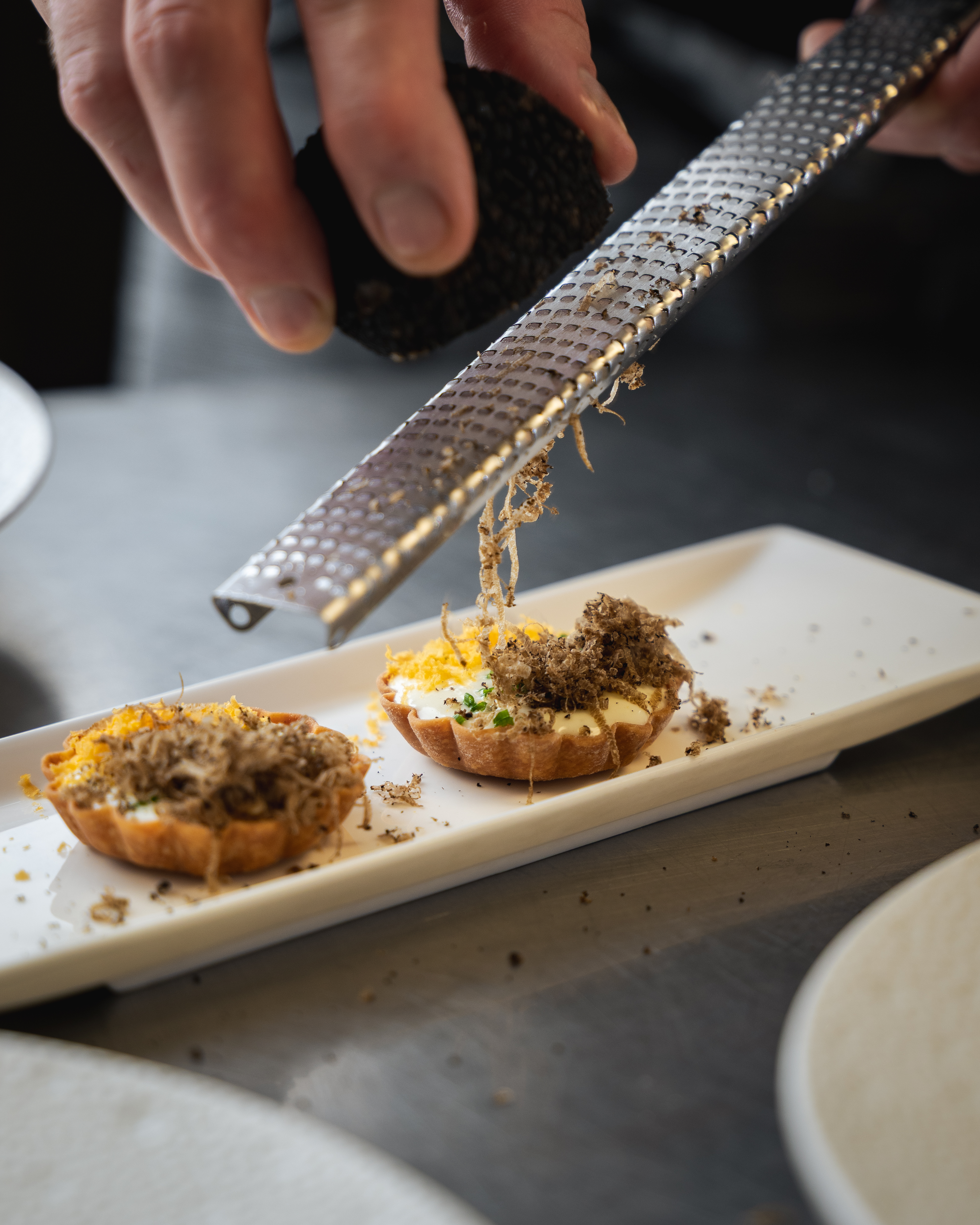 Plated tasting menu dish at 1919 Restaurant, Condado Vanderbilt – food and beverage trends in Puerto Rico